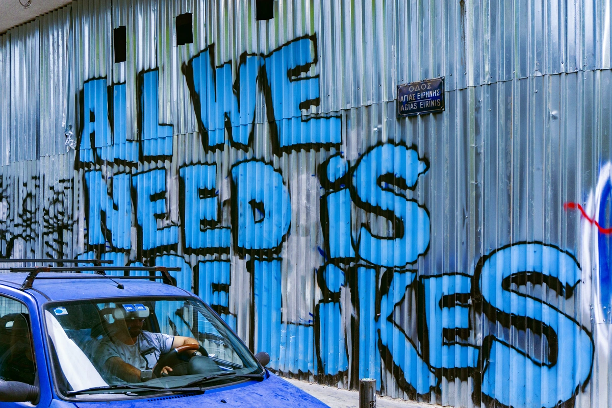 Graffiti handwriting on a outdoor factory wall with a very important social media KPI to monitor, All We Need Is More Likes.